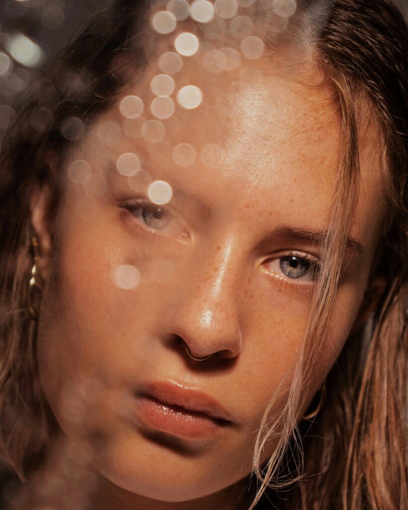 A woman with long hair and blue eyes.